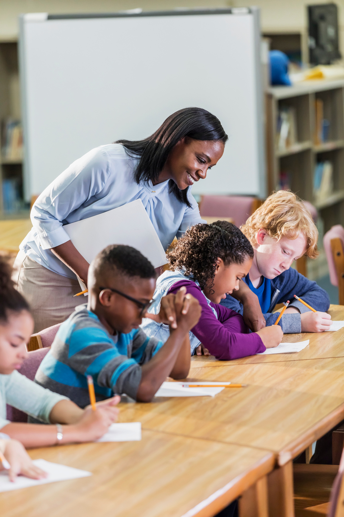 African-American teacher with elementary students